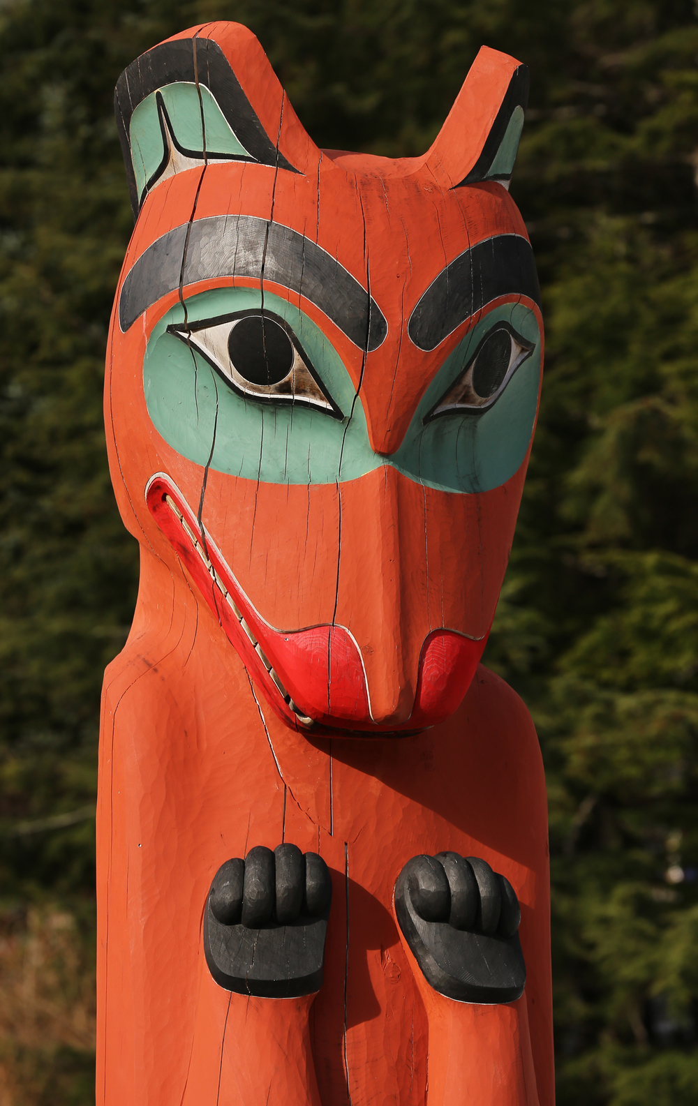 This bear totem is a reproduction carved by Donald Varnell, who says that he likes to "push the form." He brings in strong relief, lively curves, and an animated tension to his work.